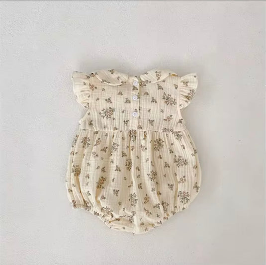 Barboteuse bébé fille fleurie en coton nid d’abeille