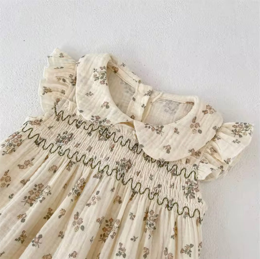 Barboteuse bébé fille fleurie en coton nid d’abeille