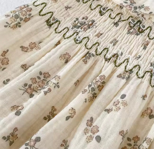 Barboteuse bébé fille fleurie en coton nid d’abeille