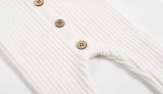 Baby girl's white knitted cotton long-sleeved romper